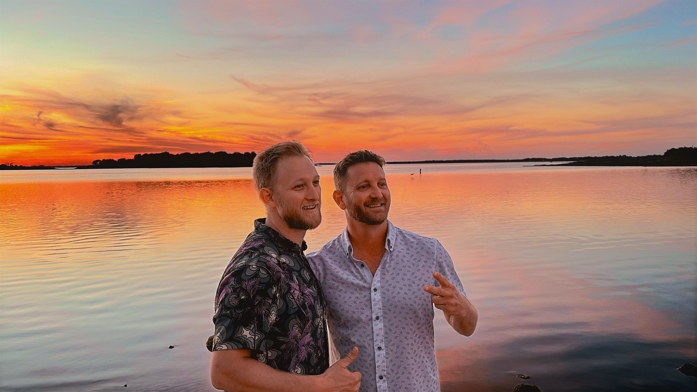 Harley and Tyler Schild, the park's owners, smiling in front of a Lake Somerville sunset.