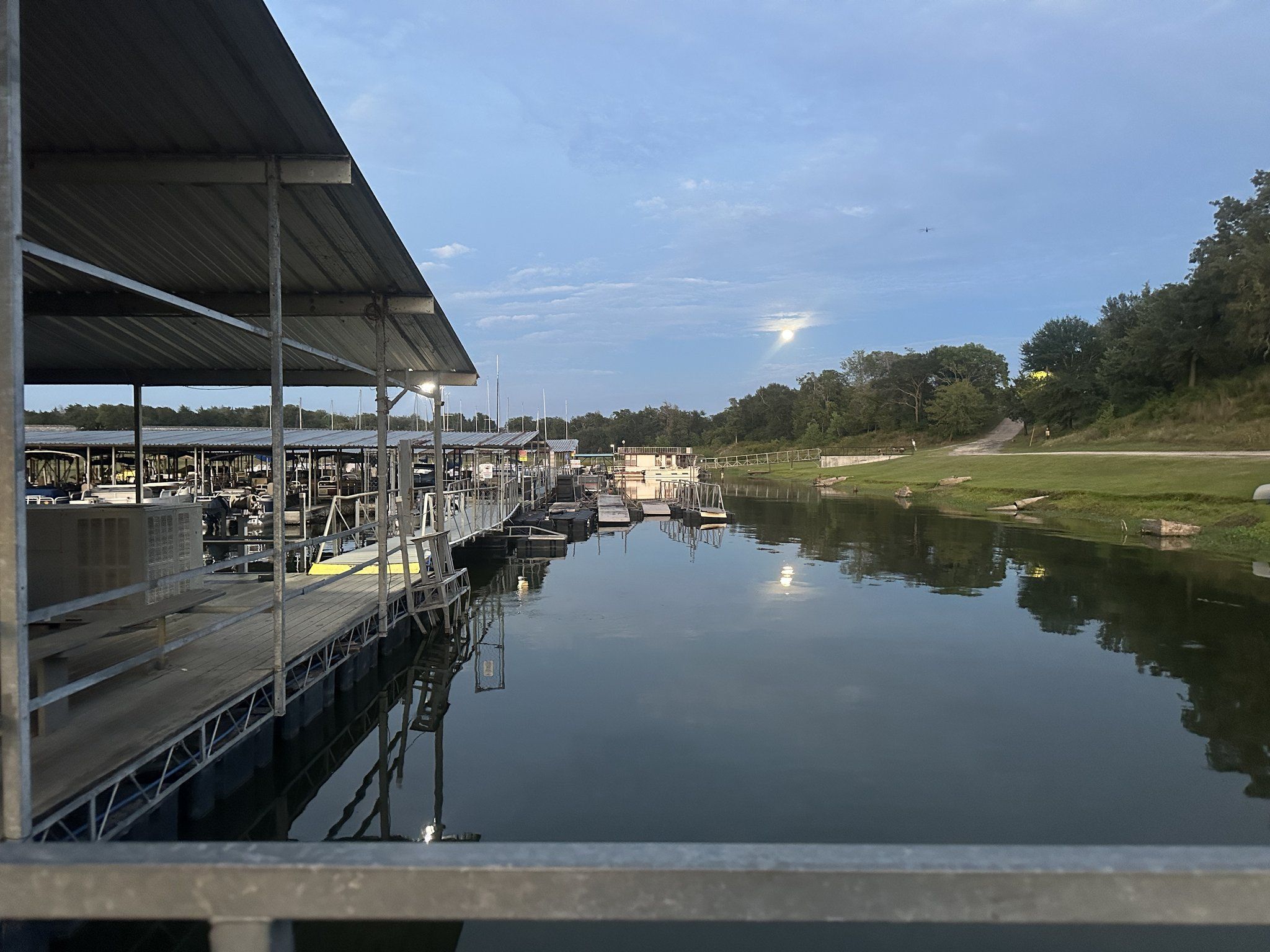 Covered boat slips at Overlook Park & Marina on Lake Somerville in warm evening light